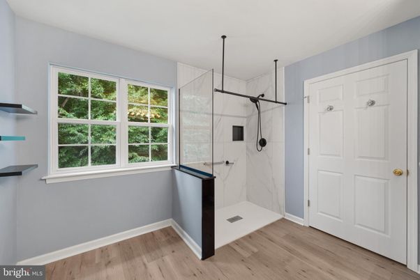 Bathroom, Glass Shower, Interior, Marble Walls, Wood Texture Flooring