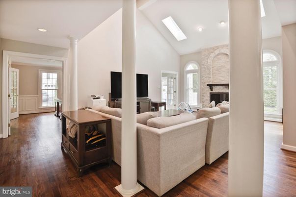 Fireplace, Interior, Living room, Recessed Lighting, Stone Walls, Wood Texture Flooring