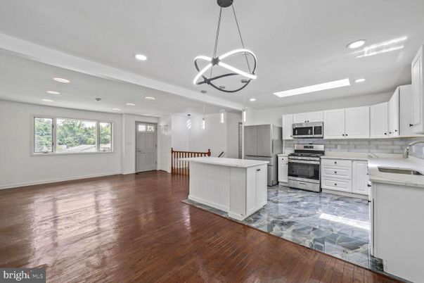 Chandelier, Interior, Kitchen, Pendant Lights, Recessed Lighting, Stainless Steel Appliances, Wood Texture Flooring