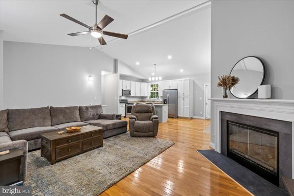 Fireplace, Interior, Kitchen, Living room, Pendant Lights, Recessed Lighting, Stainless Steel Appliances, Wood Texture Flooring