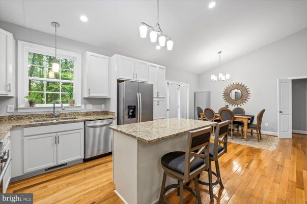 Dining room, Interior, Kitchen, Pendant Lights, Recessed Lighting, Stainless Steel Appliances, Wood Texture Flooring