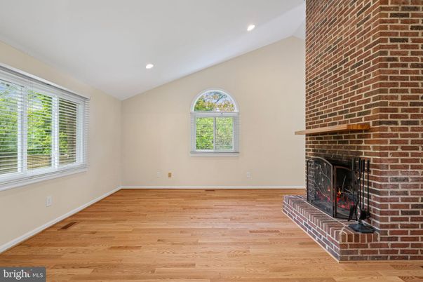 Empty room, Fireplace, Interior, Recessed Lighting, Stone Walls, Wood Texture Flooring