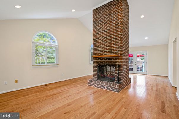 Empty room, Fireplace, Interior, Recessed Lighting, Stone Walls, Wood Texture Flooring