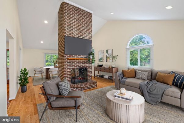 Dining room, Fireplace, Interior, Living room, Recessed Lighting, Stone Walls, Wood Texture Flooring
