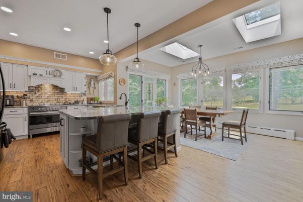 Dining room, Interior, Kitchen, Pendant Lights, Recessed Lighting, Stainless Steel Appliances, Wood Texture Flooring