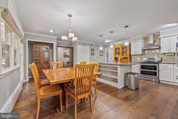 Dining room, Interior, Kitchen, Pendant Lights, Recessed Lighting, Stainless Steel Appliances, Wood Texture Flooring