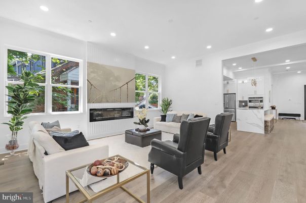 Fireplace, Interior, Kitchen, Living room, Pendant Lights, Recessed Lighting, Stainless Steel Appliances, Wood Texture Flooring