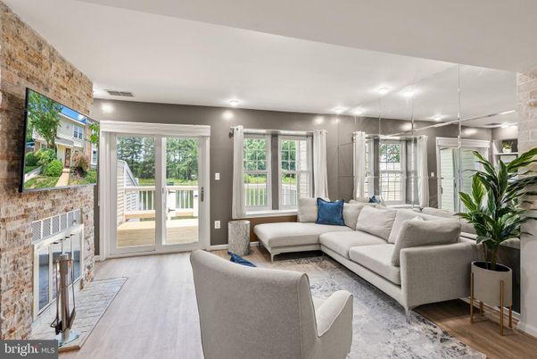 Fireplace, Interior, Living room, Recessed Lighting, Stone Walls, Wood Texture Flooring