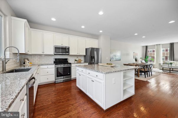 Dining room, Interior, Kitchen, Recessed Lighting, Stainless Steel Appliances, Wood Texture Flooring