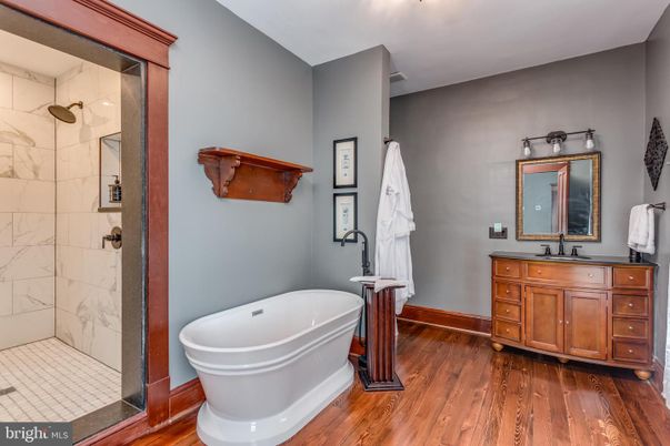Bathroom, Glass Shower, Interior, Marble Walls, Wood Texture Flooring