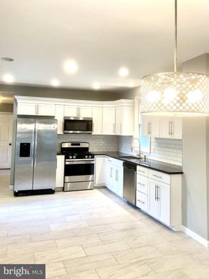 Interior, Kitchen, Marble, Pendant Lights, Recessed Lighting, Stainless Steel Appliances, Wood Texture Flooring