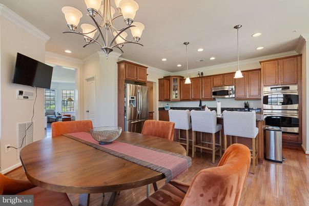 Chandelier, Dining room, Interior, Kitchen, Pendant Lights, Recessed Lighting, Stainless Steel Appliances, Wood Texture Flooring