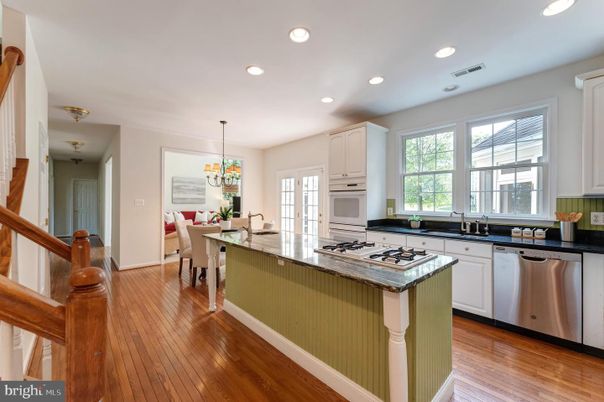 Chandelier, Dining room, Interior, Kitchen, Recessed Lighting, Stainless Steel Appliances, Wood Texture Flooring
