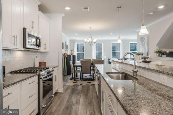 Chandelier, Dining room, Interior, Kitchen, Pendant Lights, Recessed Lighting, Stainless Steel Appliances, Wood Texture Flooring