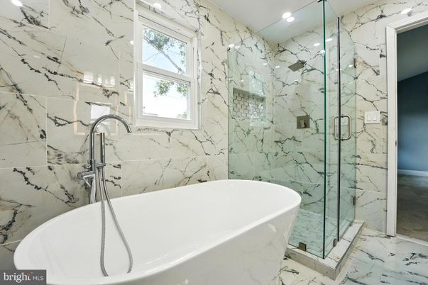 Bathroom, Free Standing Baths, Glass Shower, Interior, Marble, Marble Walls, Recessed Lighting