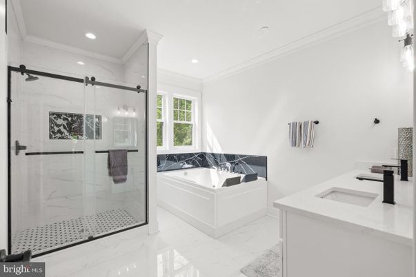 Bathroom, Dual Sink Vanities, Glass Shower, Interior, Marble, Marble Walls, Recessed Lighting