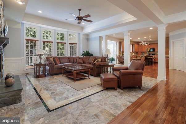 Chandelier, Dining room, Fireplace, Interior, Living room, Pendant Lights, Recessed Lighting, Wood Texture Flooring