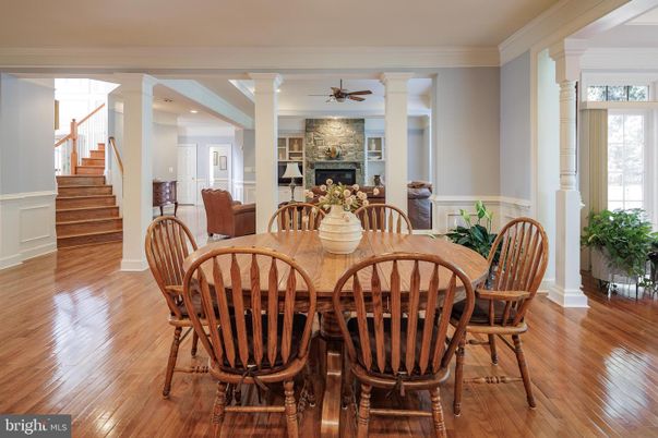 Dining room, Fireplace, Interior, Recessed Lighting, Stone Walls, Wood Texture Flooring