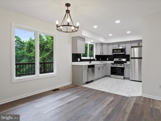 Chandelier, Interior, Kitchen, Marble, Pendant Lights, Recessed Lighting, Stainless Steel Appliances, Wood Texture Flooring