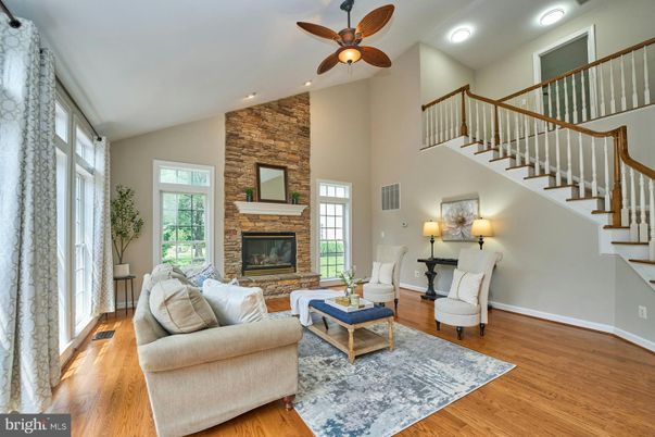 Fireplace, Interior, Living room, Recessed Lighting, Stone Walls, Wood Texture Flooring
