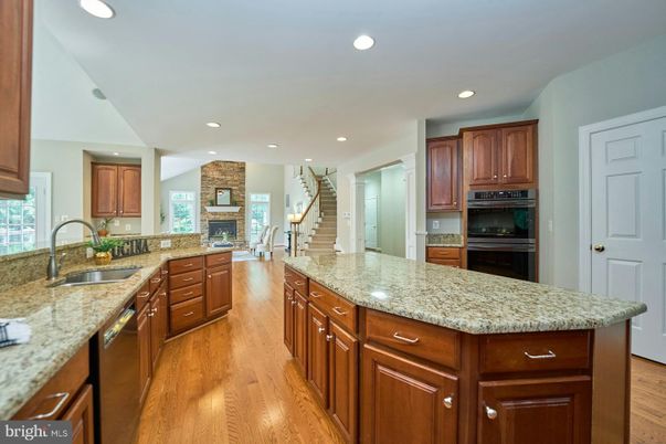 Fireplace, Interior, Kitchen, Recessed Lighting, Wood Texture Flooring