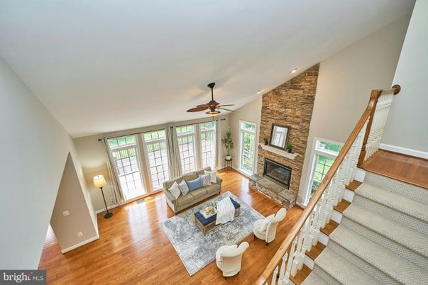 Fireplace, Interior, Living room, Recessed Lighting, Stone Walls, Wood Texture Flooring
