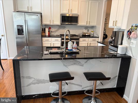 Interior, Kitchen, Marble Walls, Stainless Steel Appliances, Wood Texture Flooring