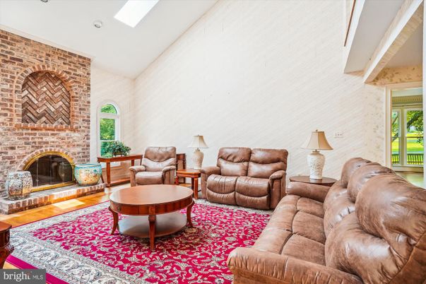 Fireplace, Interior, Living room, Recessed Lighting, Stone Walls, Wood Texture Flooring