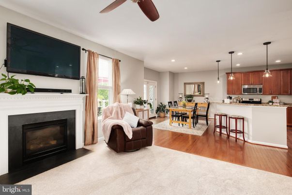 Dining room, Fireplace, Interior, Kitchen, Pendant Lights, Recessed Lighting, Stainless Steel Appliances, Wood Texture Flooring