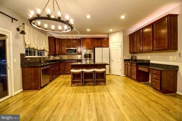 Chandelier, Interior, Kitchen, Recessed Lighting, Stainless Steel Appliances, Wood Texture Flooring