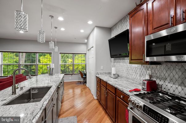 Interior, Kitchen, Pendant Lights, Recessed Lighting, Stainless Steel Appliances, Wood Texture Flooring
