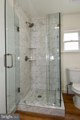 Bathroom, Glass Shower, Interior, Marble Walls, Wood Texture Flooring