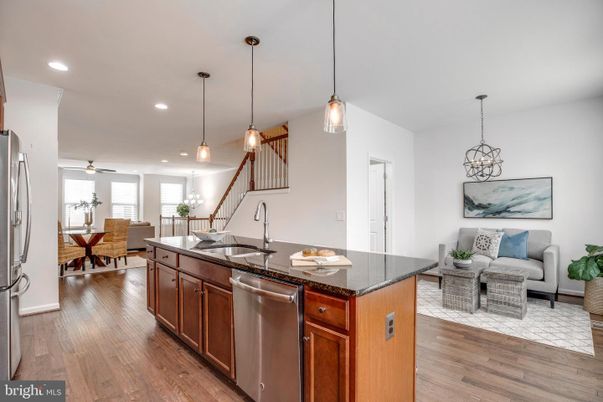 Dining room, Interior, Kitchen, Living room, Pendant Lights, Recessed Lighting, Stainless Steel Appliances, Wood Texture Flooring
