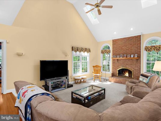 Fireplace, Interior, Living room, Recessed Lighting, Stone Walls, Wood Texture Flooring