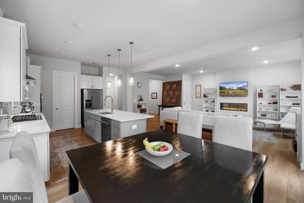 Dining room, Fireplace, Interior, Kitchen, Living room, Pendant Lights, Recessed Lighting, Stainless Steel Appliances, Wood Texture Flooring
