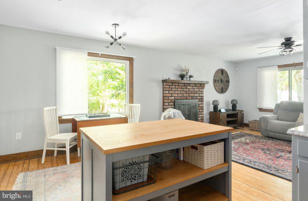 Dining room, Fireplace, Interior, Pendant Lights, Wood Texture Flooring