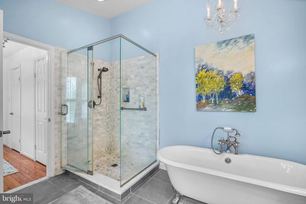 Bathroom, Chandelier, Free Standing Baths, Glass Shower, Interior, Recessed Lighting, Wood Texture Flooring