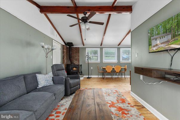 Dining room, Fireplace, Interior, Living room, Stone Walls, Wooden Beams, Wood Texture Flooring