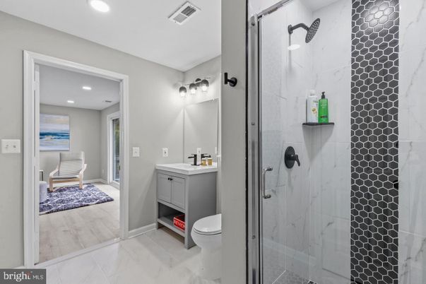 Bathroom, Glass Shower, Interior, Marble Walls, Recessed Lighting, Wood Texture Flooring
