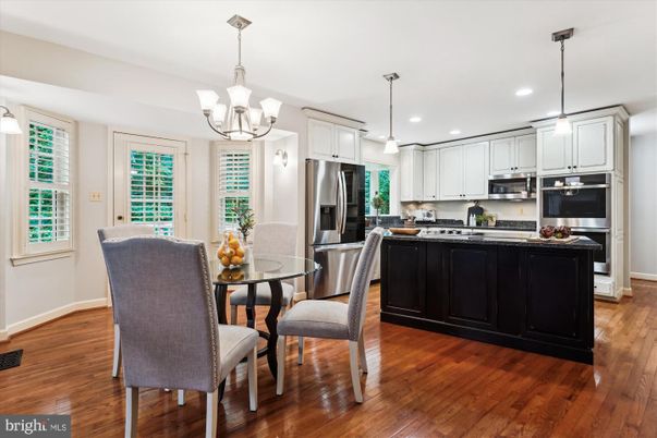 Chandelier, Dining room, Interior, Kitchen, Pendant Lights, Recessed Lighting, Stainless Steel Appliances, Wood Texture Flooring