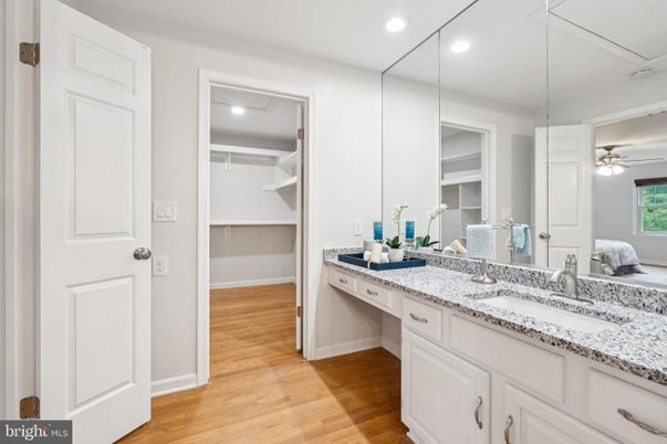 Bathroom, Dual Sink Vanities, Interior, Recessed Lighting, Walk-in Closets, Wood Texture Flooring