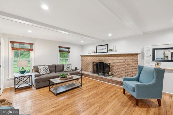 Fireplace, Interior, Living room, Recessed Lighting, Stone Walls, Wood Texture Flooring