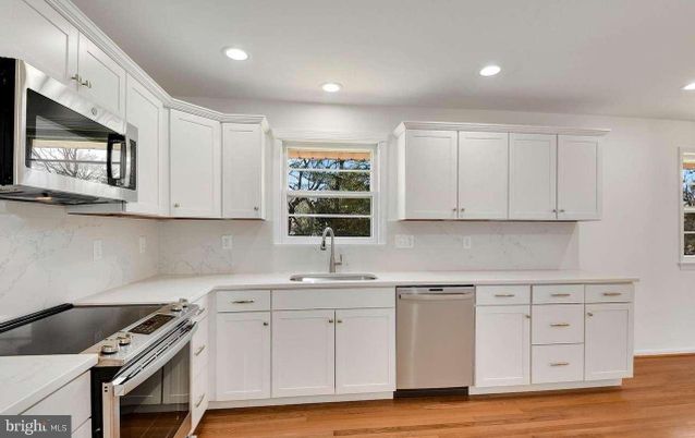 Interior, Kitchen, Marble Walls, Recessed Lighting, Stainless Steel Appliances, Wood Texture Flooring