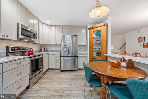 Dining room, Interior, Kitchen, Recessed Lighting, Stainless Steel Appliances, Wood Texture Flooring