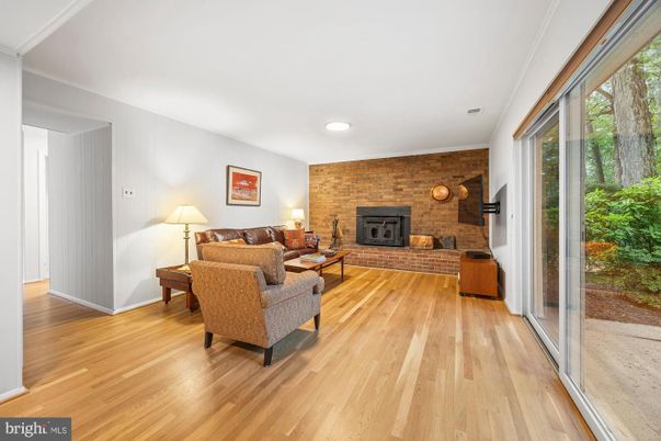 Fireplace, Interior, Living room, Recessed Lighting, Stone Walls, Wood Texture Flooring