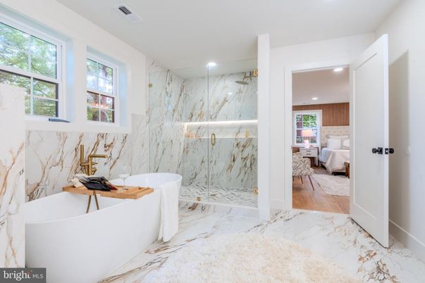 Bathroom, Bedroom, Free Standing Baths, Glass Shower, Interior, Marble, Marble Walls, Recessed Lighting, Wood Texture Flooring