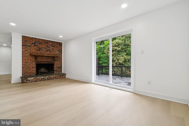 Empty room, Fireplace, Interior, Recessed Lighting, Stone Walls, Wood Texture Flooring