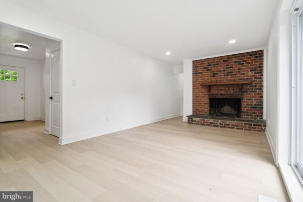 Empty room, Fireplace, Interior, Recessed Lighting, Stone Walls, Wood Texture Flooring