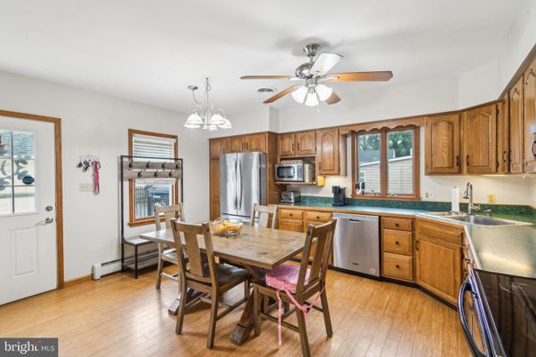 Dining room, Interior, Kitchen, Pendant Lights, Stainless Steel Appliances, Wood Texture Flooring