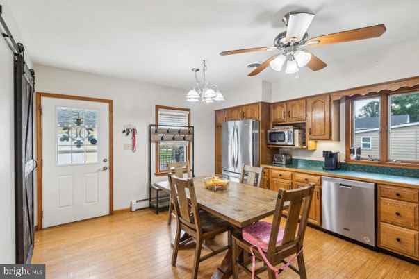 Dining room, Interior, Kitchen, Pendant Lights, Stainless Steel Appliances, Wood Texture Flooring